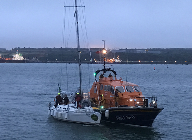 The yacht, with a fouled propeller, in an alongside tow with Angle RNLI’s all weather lifeboat. Credit: Angle RNLI