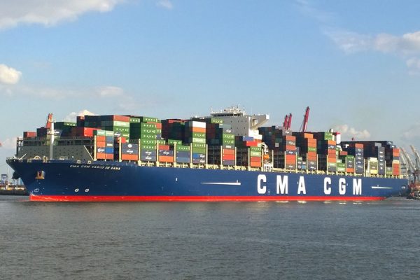 A cargo ship with a blue and red hull grounded off Southampton