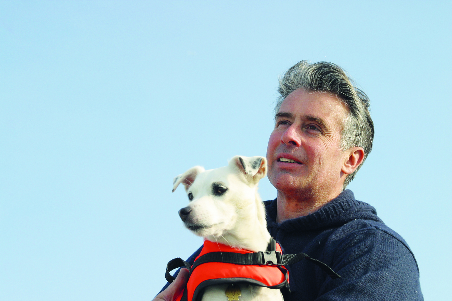 Dave Selby in blue jumper with his dog. He will be speaking at the London Boat Show