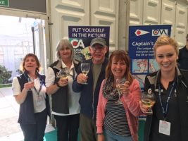 cruising association drinking champagne with its members