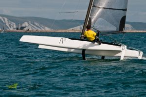 A sailor in a yellow top on a boat