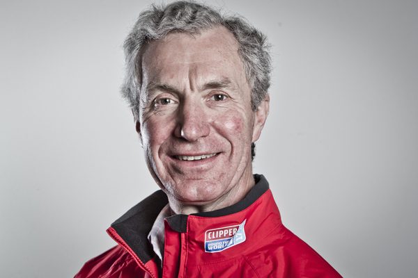 Clipper Race sailor Simon Speirs dressed in red