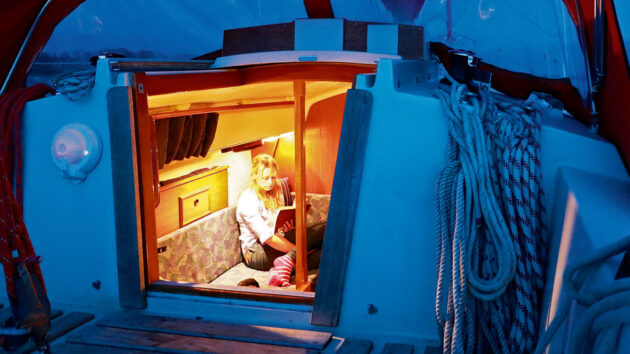 A woman reading on a boat