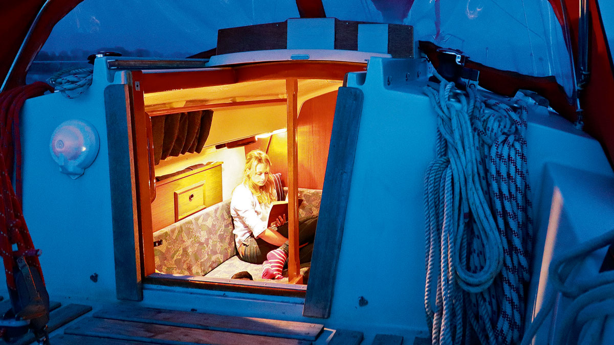 A woman reading on a boat