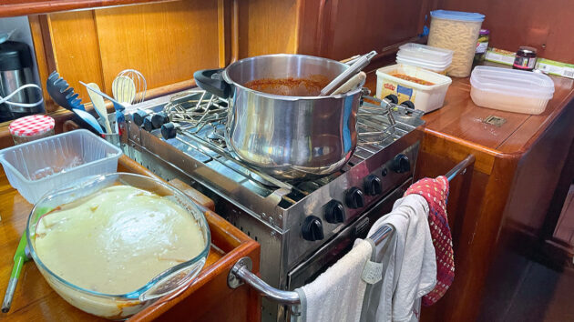 A pot on a galley stove on a yacht