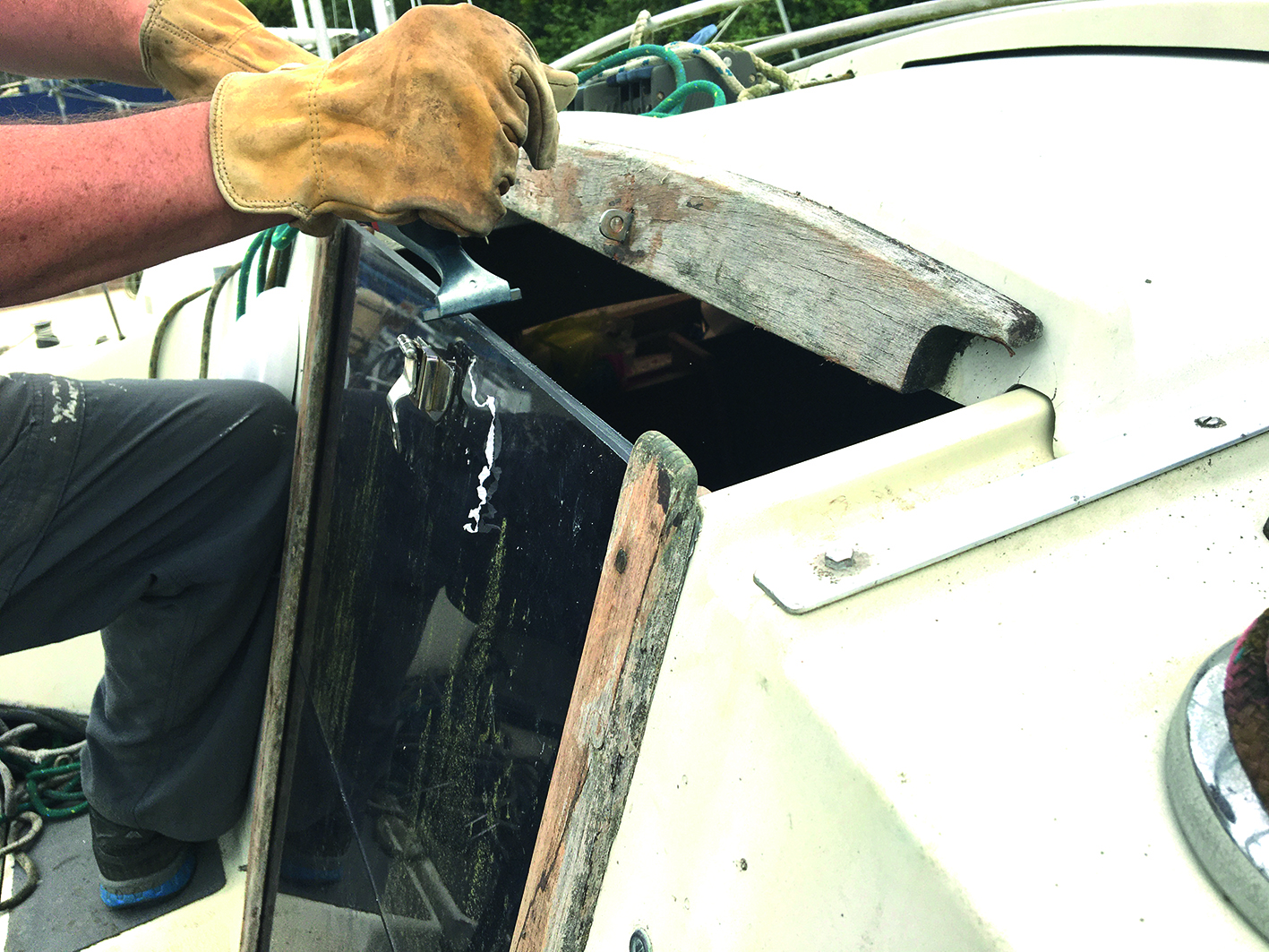 Using the scraper to remove a few millimetres of washboard Perspex