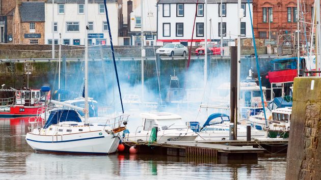 smoking-boat-engine-PBO281.experts.alamy_p96g4m