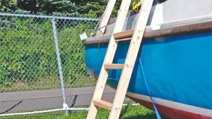 The ladder is in place and ready to use – note the top rung is level with side deck toerail. Credit: Zoran Glozinic