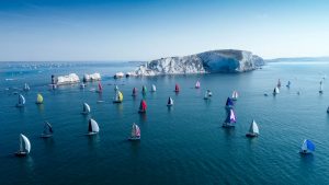 Boat with coloured sails taking part in the round the island race