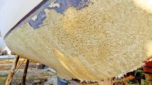 A boat hull showing signs of boat osmosis