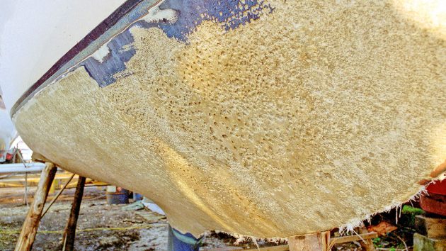 A boat hull showing signs of boat osmosis