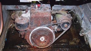 An old boat engine covered in rust