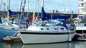 A boat with a white hull moored