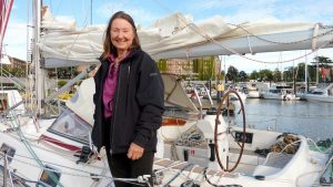 Jeanne Socrates standing on the deck of a boat