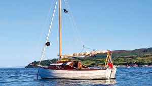 A home-built boat floating at anchor