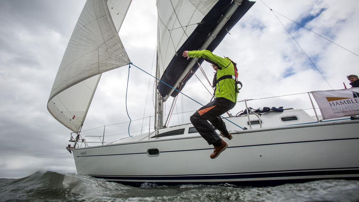 A man falling overboard from a boat