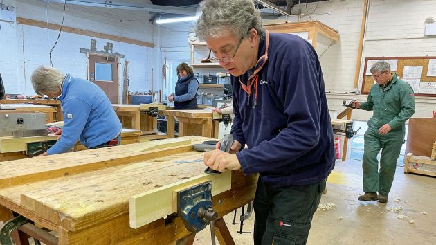 A man using a woodworking tool