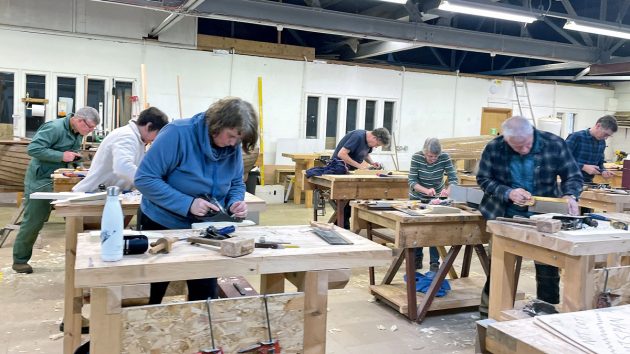 Students Practising scarf joints during a how to become a boat builder course