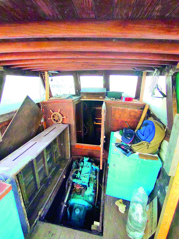 Inside of a boat that needs a lot of work