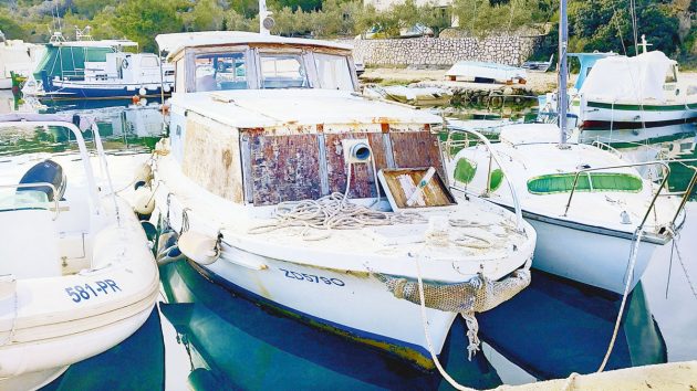 a old Pasara working boat moored in a marina