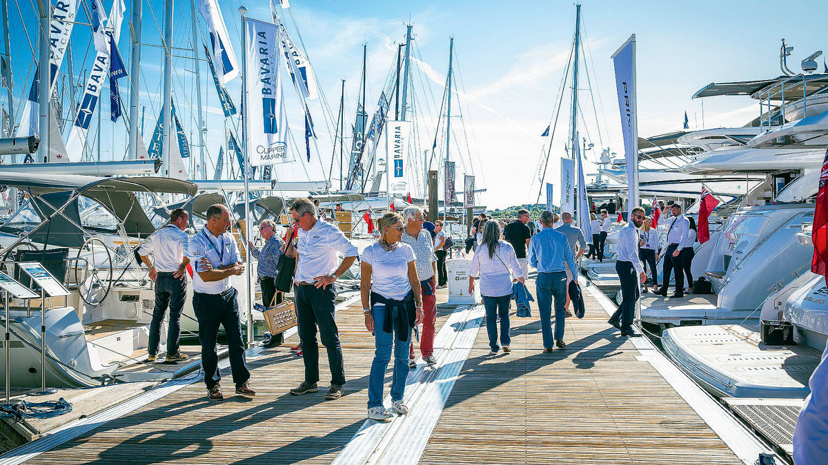 People walking on pontoons during a boat show