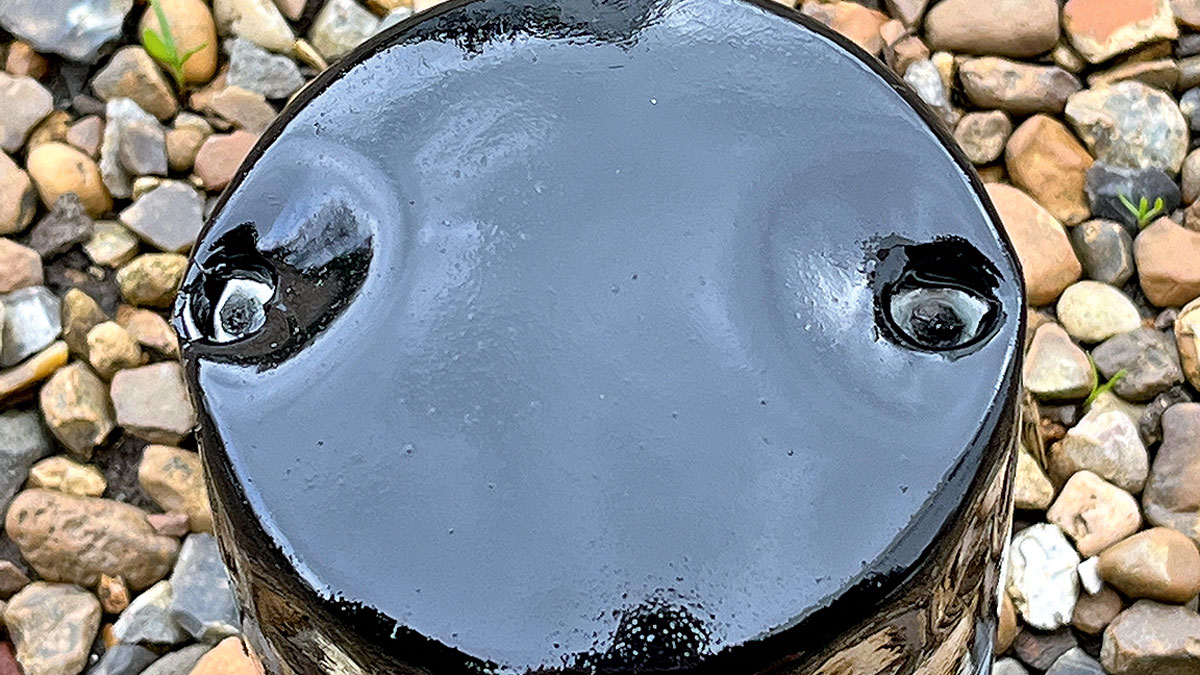 An old oil filter with punched holes