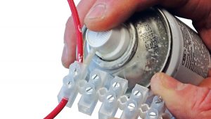 Spraying a connector for electrical wiring