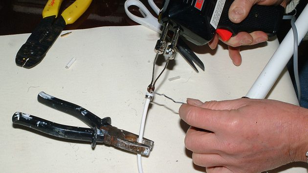 10. Now tin the inner cable with electrical resin-cored solder. Keep this to a minimum or the cable will not enter the pin.