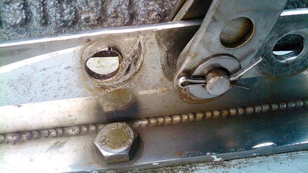 A clevis pin on a mast which has become deformed. Leave it and you could risk a dismasting