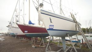 A boat with a for sale sign on it