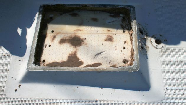 A rotten mast step on a deck of a boat