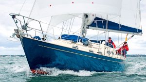 People on a boat which is sailing around the UK