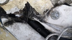 The remains of a dinghy after a fire on board a yacht
