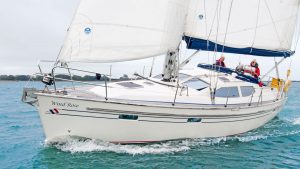 A man sailing in a white yacht