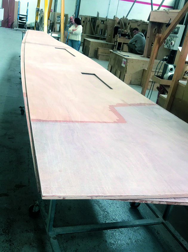 An entire boat length of topside panel scarfed and glued together. This is done off the boat, then the whole length is offered up to the jig.