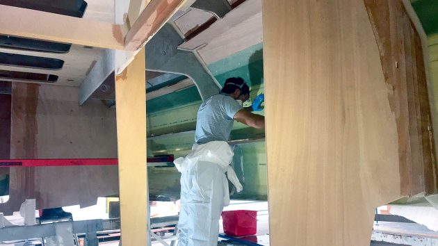 Epoxy laminate being applied to plywood boats