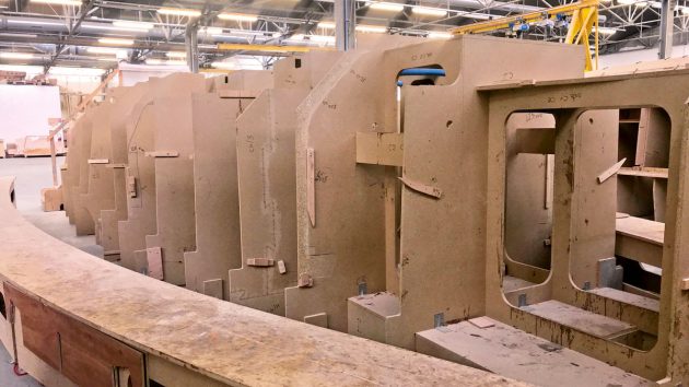 Plywood boats being built in a factory