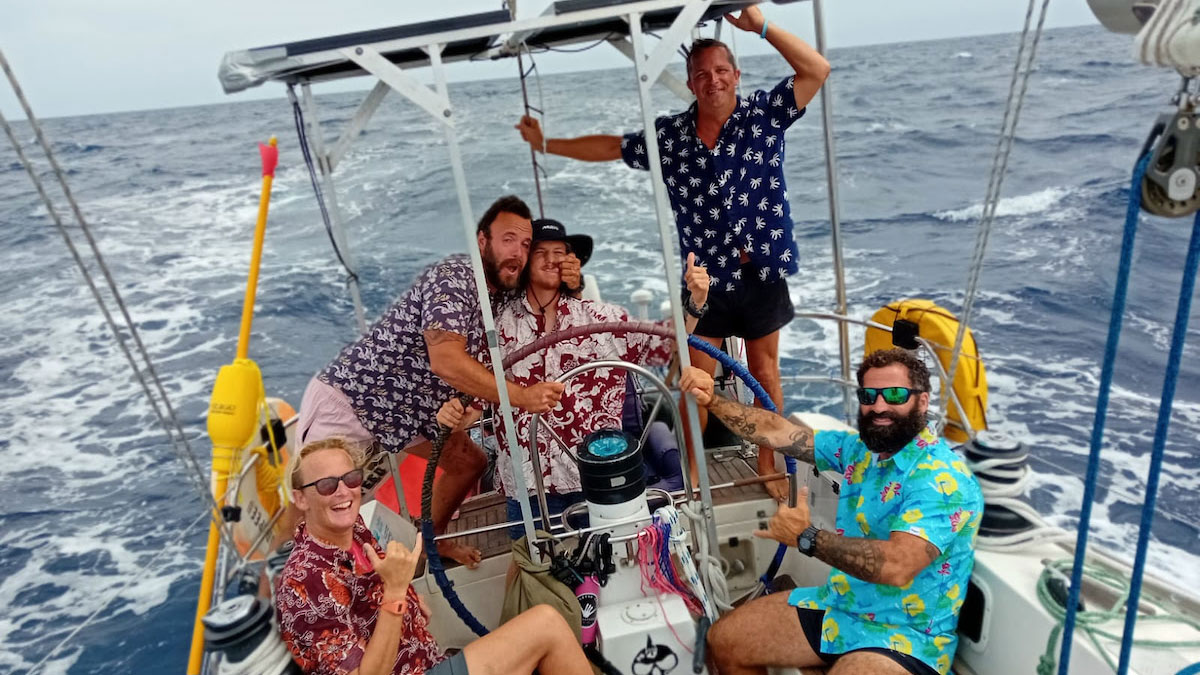 The crew of Godspeed on a boat during the Ocean Globe Race