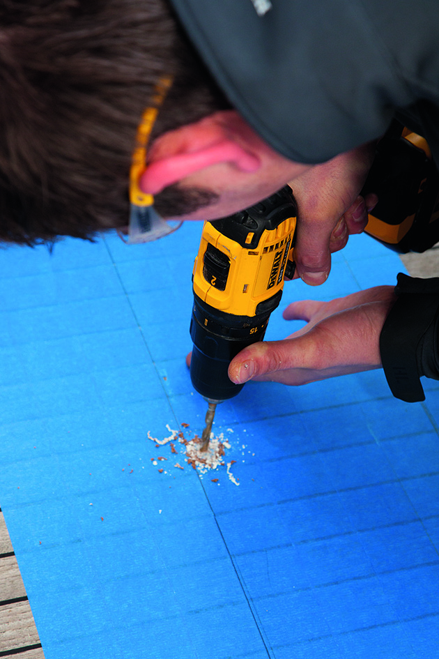 A man drilling on a yacht