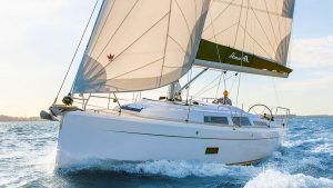 A man sailing a Hanse 348 sailing yacht