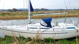 A boat moored up alongside a riverboat