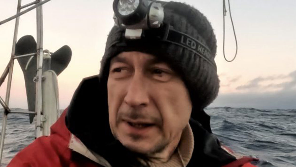 Russian sailor Roman Titov wearing a hat