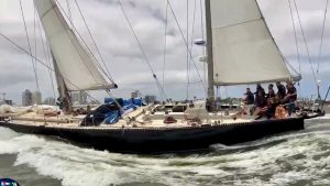 Marie Tabarly and the crew of Pen Duick VI cross the finish line