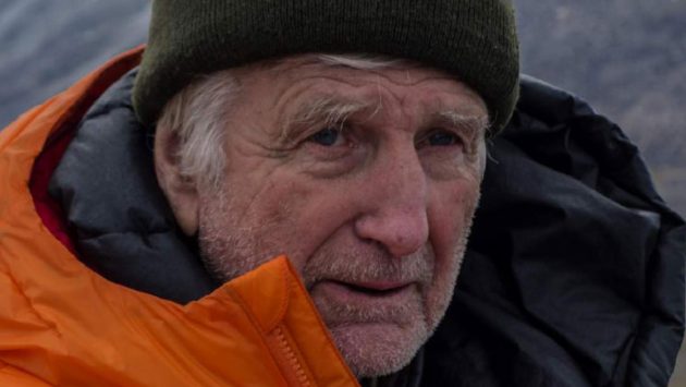 Teh REv Bob Shepton wearing an orange coat and black hat