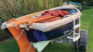 A Lune Piot 11 dinghy on a trailer