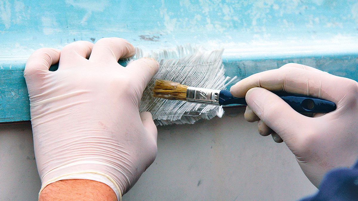 A person carrying out Boat fibreglass repair