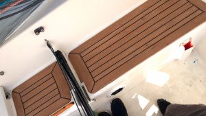 Synthetic teak in a cockpit of a boat