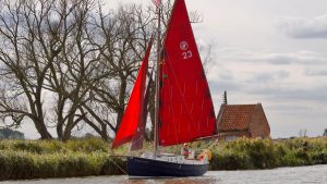 Cornish Crabbers 22 sailing down a river