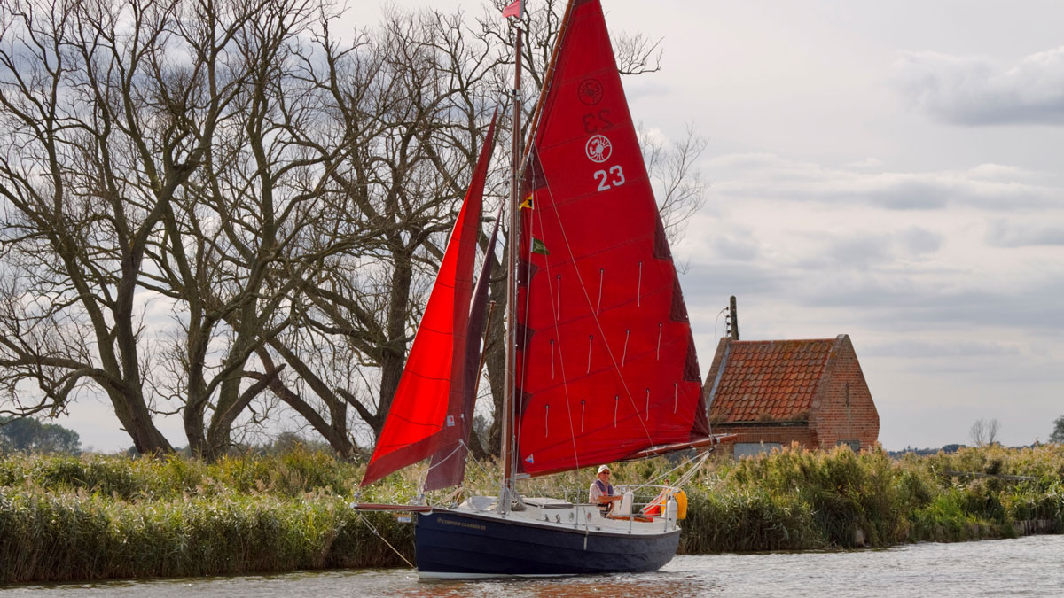 Cornish Crabbers 22 sailing down a river