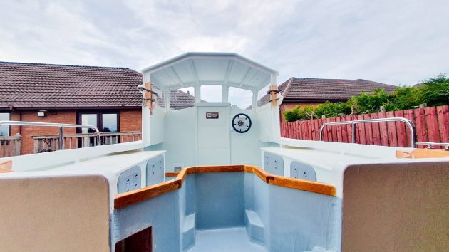 A painted wheelhouse on a motorboat